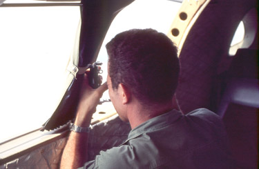 Maintenance Officer taking photos out the window. Photo by CPT Bob Dodge
